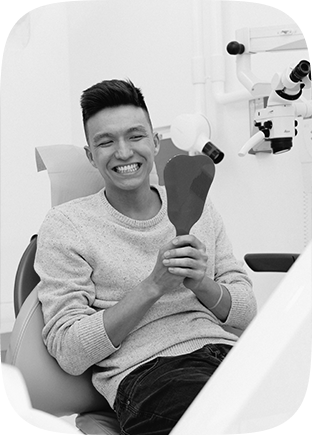 Patient Smiling with Implant Dentures